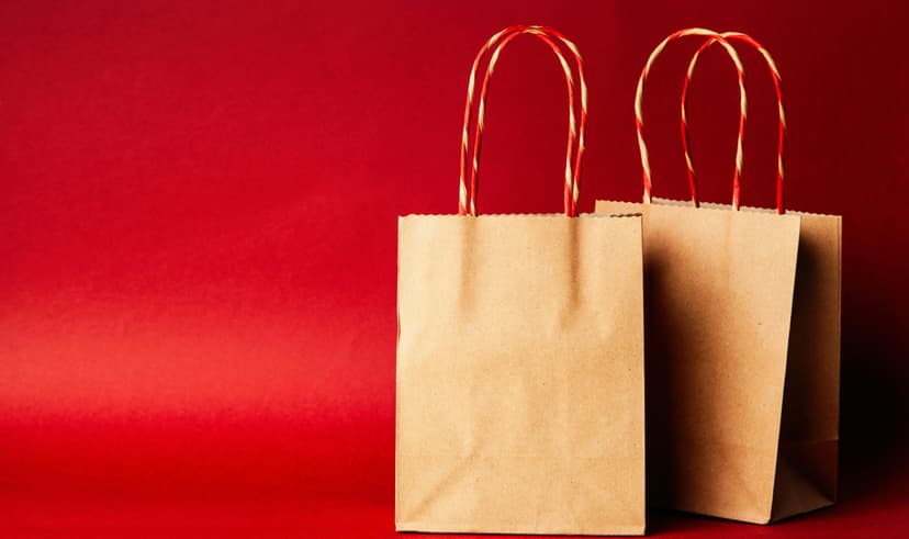 Brown paper bags on red background