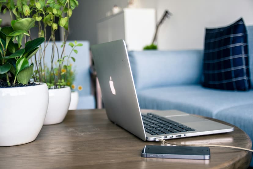 Laptop and iPhone on desk