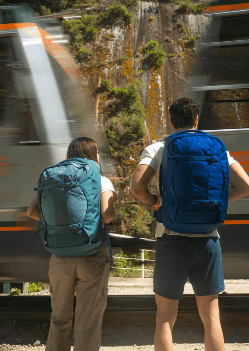 Woman and man wearing Osprey backpacks